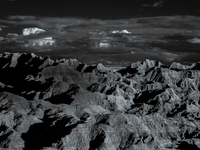 Badlands National Park protects 242,756 acres (379.3 sq mi; 982.4 km2) of sharply eroded buttes and pinnacles, along with the largest undist...