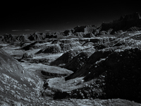 Badlands National Park protects 242,756 acres (379.3 sq mi; 982.4 km2) of sharply eroded buttes and pinnacles, along with the largest undist...