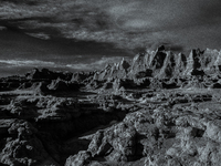 Badlands National Park protects 242,756 acres (379.3 sq mi; 982.4 km2) of sharply eroded buttes and pinnacles, along with the largest undist...