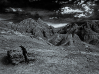 Badlands National Park protects 242,756 acres (379.3 sq mi; 982.4 km2) of sharply eroded buttes and pinnacles, along with the largest undist...