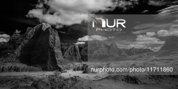 Badlands National Park protects 242,756 acres (379.3 sq mi; 982.4 km2) of sharply eroded buttes and pinnacles, along with the largest undist...