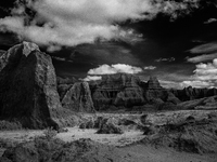 Badlands National Park protects 242,756 acres (379.3 sq mi; 982.4 km2) of sharply eroded buttes and pinnacles, along with the largest undist...