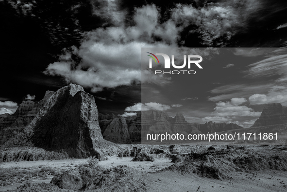 Badlands National Park protects 242,756 acres (379.3 sq mi; 982.4 km2) of sharply eroded buttes and pinnacles, along with the largest undist...