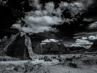 Badlands National Park protects 242,756 acres (379.3 sq mi; 982.4 km2) of sharply eroded buttes and pinnacles, along with the largest undist...