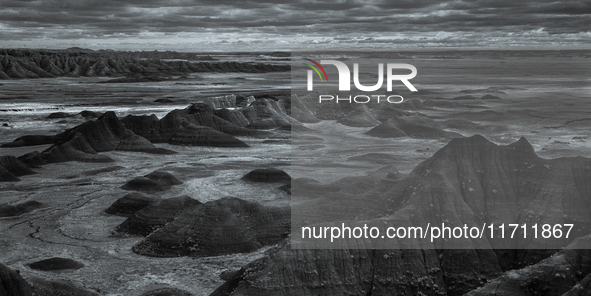 Badlands National Park protects 242,756 acres (379.3 sq mi; 982.4 km2) of sharply eroded buttes and pinnacles, along with the largest undist...