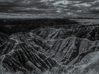 Badlands National Park protects 242,756 acres (379.3 sq mi; 982.4 km2) of sharply eroded buttes and pinnacles, along with the largest undist...