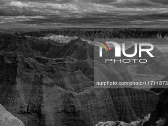 Badlands National Park protects 242,756 acres (379.3 sq mi; 982.4 km2) of sharply eroded buttes and pinnacles, along with the largest undist...