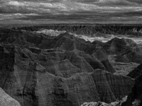 Badlands National Park protects 242,756 acres (379.3 sq mi; 982.4 km2) of sharply eroded buttes and pinnacles, along with the largest undist...