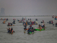 Kashmiri women row boats during the traditional women's boat race at Dal Lake in Srinagar, Jammu and Kashmir, on October 27, 2024. The Jammu...