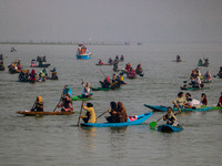 Kashmiri women row boats during the traditional women's boat race at Dal Lake in Srinagar, Jammu and Kashmir, on October 27, 2024. The Jammu...