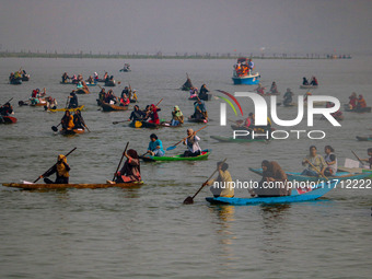 Kashmiri women row boats during the traditional women's boat race at Dal Lake in Srinagar, Jammu and Kashmir, on October 27, 2024. The Jammu...