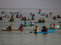 Kashmiri women row boats during the traditional women's boat race at Dal Lake in Srinagar, Jammu and Kashmir, on October 27, 2024. The Jammu...