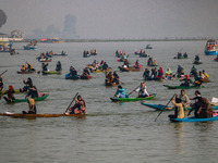 Kashmiri women row boats during the traditional women's boat race at Dal Lake in Srinagar, Jammu and Kashmir, on October 27, 2024. The Jammu...