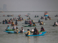 Kashmiri women row boats during the traditional women's boat race at Dal Lake in Srinagar, Jammu and Kashmir, on October 27, 2024. The Jammu...