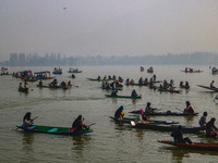 Kashmiri women row boats during the traditional women's boat race at Dal Lake in Srinagar, Jammu and Kashmir, on October 27, 2024. The Jammu...