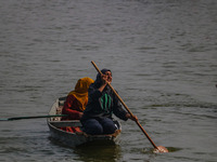 Kashmiri women row boats during the traditional women's boat race at Dal Lake in Srinagar, Jammu and Kashmir, on October 27, 2024. The Jammu...