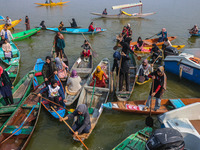 Kashmir girls react near the finish line during the traditional women's boat race in Srinagar, Jammu and Kashmir, on October 27, 2024. The J...