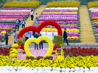 Tourists view chrysanthemums at the Chrysanthemum Garden at Jiangning Lake in Nanjing, China, on October 27, 2024. (