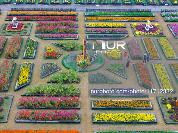 Tourists view chrysanthemums at the Chrysanthemum Garden at Jiangning Lake in Nanjing, China, on October 27, 2024. 