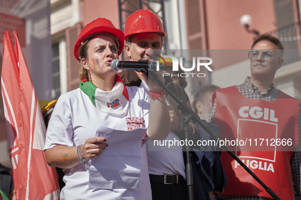 Gigia Bucci, General Secretary of CGIL Puglia, speaks at a rally advocating for world peace. Thousands of people march through Bari, Italy,...