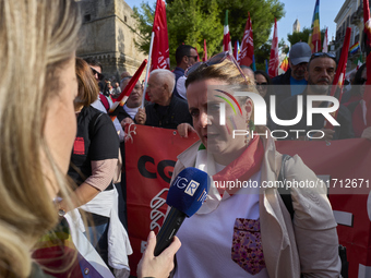 Gigia Bucci, General Secretary of CGIL Puglia, speaks at a rally advocating for world peace. Thousands of people march through Bari, Italy,...