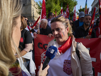 Gigia Bucci, General Secretary of CGIL Puglia, speaks at a rally advocating for world peace. Thousands of people march through Bari, Italy,...