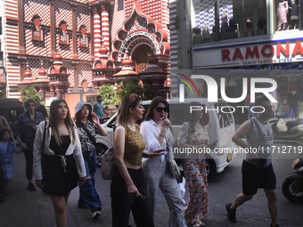 Tourists take pictures in front of the Red Mosque in Colombo, Sri Lanka, on October 26, 2024.   (