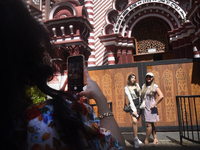 Tourists take pictures in front of the Red Mosque in Colombo, Sri Lanka, on October 26, 2024.   (