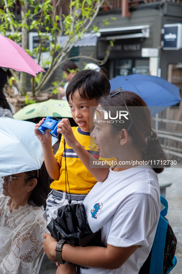 Thousands of well-wishers turn up along the shores of the Chao Phraya River in Bangkok, Thailand, on October 27, 2024, to watch Thai King Ma...