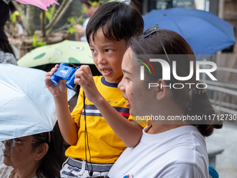 Thousands of well-wishers turn up along the shores of the Chao Phraya River in Bangkok, Thailand, on October 27, 2024, to watch Thai King Ma...