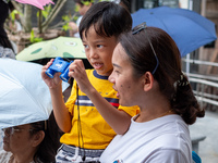 Thousands of well-wishers turn up along the shores of the Chao Phraya River in Bangkok, Thailand, on October 27, 2024, to watch Thai King Ma...