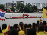 Thai oarsmen in traditional costume row during the Royal Barge Procession for the Royal Kathin ceremony along the Chao Phraya River in Bangk...