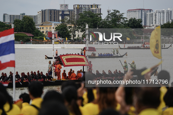 Thai oarsmen in traditional costume row during the Royal Barge Procession for the Royal Kathin ceremony along the Chao Phraya River in Bangk...