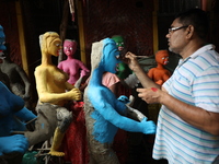 An artist paints clay idols of the Hindu mythological characters ''Dakinis'' and ''Yoginis,'' who are worshiped along with the Hindu goddess...