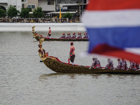 Thai oarsmen in traditional costume row during the Royal Barge Procession for the Royal Kathin ceremony along the Chao Phraya River in Bangk...