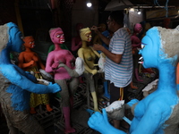 An artist paints clay idols of the Hindu mythological characters ''Dakinis'' and ''Yoginis,'' who are worshiped along with the Hindu goddess...