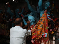 An artist paints an idol of the Hindu goddess Kali inside a workshop ahead of the Diwali festival in Kolkata, India, on October 27, 2024. Di...