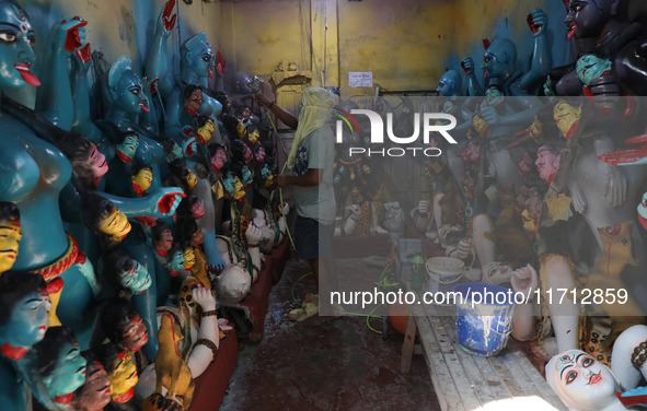 An artist paints an idol of the Hindu goddess Kali inside a workshop ahead of the Diwali festival in Kolkata, India, on October 27, 2024. Di...