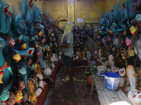 An artist paints an idol of the Hindu goddess Kali inside a workshop ahead of the Diwali festival in Kolkata, India, on October 27, 2024. Di...