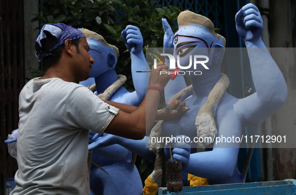 An artist paints an idol of the Hindu goddess Kali inside a workshop ahead of the Diwali festival in Kolkata, India, on October 27, 2024. Di...