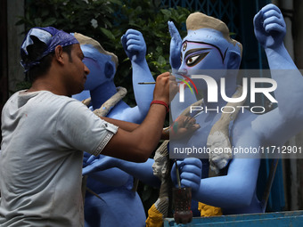 An artist paints an idol of the Hindu goddess Kali inside a workshop ahead of the Diwali festival in Kolkata, India, on October 27, 2024. Di...