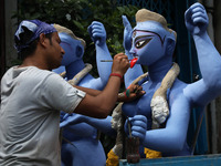 An artist paints an idol of the Hindu goddess Kali inside a workshop ahead of the Diwali festival in Kolkata, India, on October 27, 2024. Di...