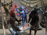 Workers carry an idol of the Hindu goddess Kali towards a workshop in Kolkata, India, on October 27, 2024. Diwali comes from the Sanskrit wo...