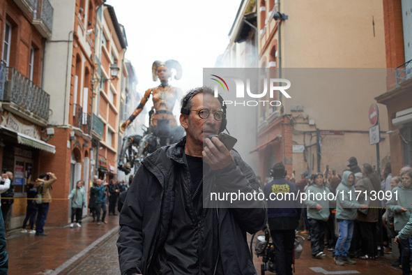 Francois Delaroziere, head of the art company 'La Machine', guides Lilith in one of the tiniest streets of Toulouse. French street show crea...