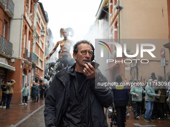 Francois Delaroziere, head of the art company 'La Machine', guides Lilith in one of the tiniest streets of Toulouse. French street show crea...