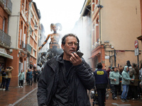 Francois Delaroziere, head of the art company 'La Machine', guides Lilith in one of the tiniest streets of Toulouse. French street show crea...