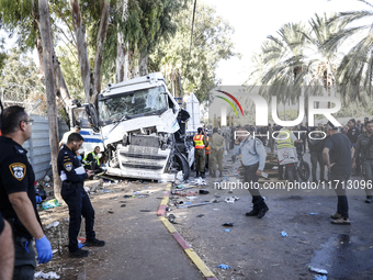 Medical and security teams respond to the scene where a truck crashed into a bus stop south of Tel Aviv, Israel, on October 27, 2024. The in...