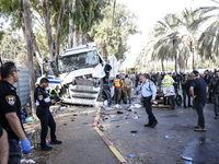 Medical and security teams respond to the scene where a truck crashed into a bus stop south of Tel Aviv, Israel, on October 27, 2024. The in...