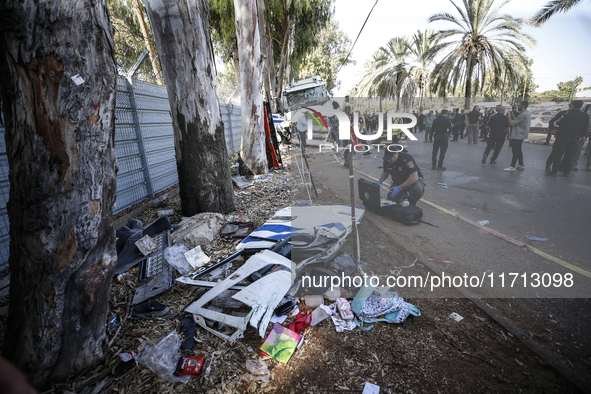 Medical and security teams respond to the scene where a truck crashed into a bus stop south of Tel Aviv, Israel, on October 27, 2024. The in...