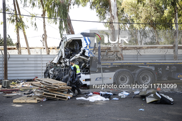 Medical and security teams respond to the scene where a truck crashed into a bus stop south of Tel Aviv, Israel, on October 27, 2024. The in...